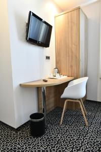 TV a/nebo společenská místnost v ubytování In Situ Hotel