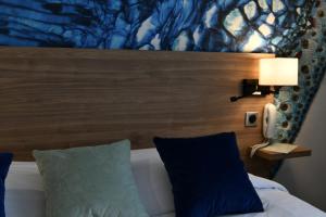 Postel nebo postele na pokoji v ubytování In Situ Hotel