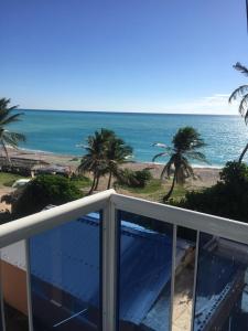a view of the ocean from the balcony of a condo at Hotel Vista Sur in Los Patos