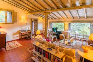 a living room with a couch and a table at Posada Real La Casa de Arriba in Navarredonda de Gredos