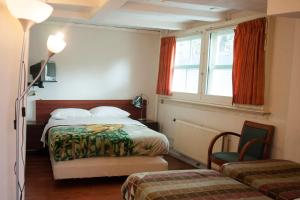 Ένα ή περισσότερα κρεβάτια σε δωμάτιο στο Hostel The Veteran