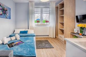 Telewizja i/lub zestaw kina domowego w obiekcie Apartamenty Novomiejska 17