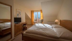 Letto o letti in una camera di Hotel Gasthof Mostwastl
