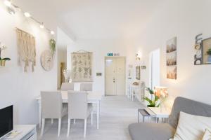 A television and/or entertainment centre at White Napoleone Apartment