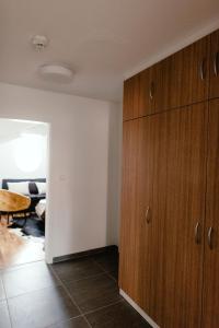 
a kitchen with a wooden floor and a white refrigerator at Luxury Apartments Zelny Trh in Brno
