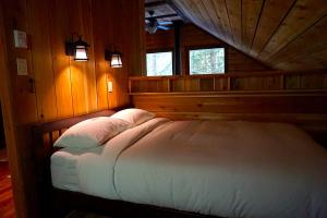 Postel nebo postele na pokoji v ubytování Logden Lodge