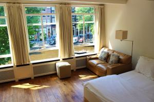 Postel nebo postele na pokoji v ubytování Amsterdam Jewel Canal Apartments