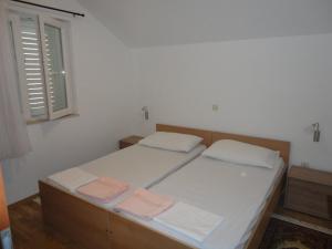 Ein Bett oder Betten in einem Zimmer der Unterkunft Apartments Marija