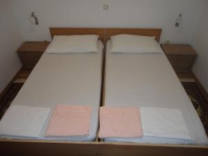 Ein Bett oder Betten in einem Zimmer der Unterkunft Apartments Marija
