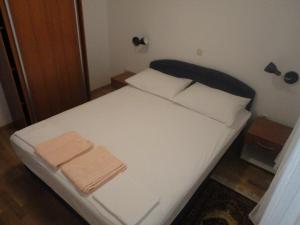 Ein Bett oder Betten in einem Zimmer der Unterkunft Apartments Marija