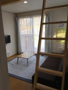 Postel nebo postele na pokoji v ubytování Guest House Iwato