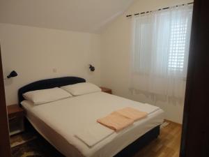 Ein Bett oder Betten in einem Zimmer der Unterkunft Apartments Marija