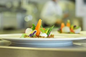 a plate of food sitting on a table at Skotel Amsterdam, Hotelschool The Hague in Amsterdam