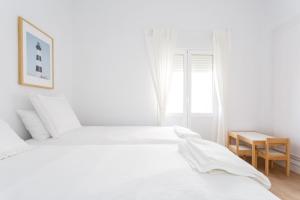 Posteľ alebo postele v izbe v ubytovaní FARO Family Home by Cadiz4Rentals