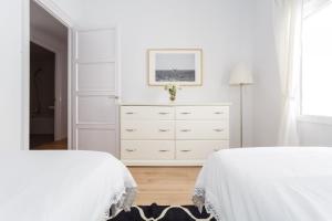 Posteľ alebo postele v izbe v ubytovaní FARO Family Home by Cadiz4Rentals