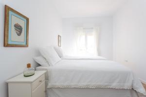 Posteľ alebo postele v izbe v ubytovaní FARO Family Home by Cadiz4Rentals