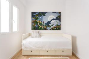 Posteľ alebo postele v izbe v ubytovaní FARO Family Home by Cadiz4Rentals