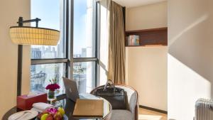Area soggiorno di SSAW Boutique Hotel Ningbo CBD