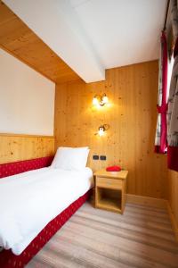 Postel nebo postele na pokoji v ubytování Hotel Funivia