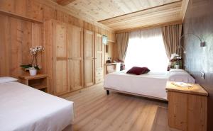 Postel nebo postele na pokoji v ubytování Hotel Funivia