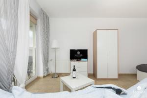 Televízia a/alebo spoločenská miestnosť v ubytovaní Jantar Apartamenty- Zielone Tarasy