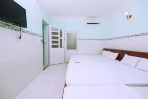 Postel nebo postele na pokoji v ubytování Sevensea Vung Tau