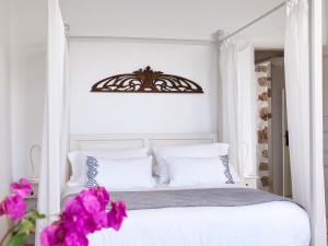 Postel nebo postele na pokoji v ubytování Patmos Eye Boutique Hotel & Villas