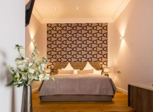 Postel nebo postele na pokoji v ubytování anders Kontorhaus Hotel