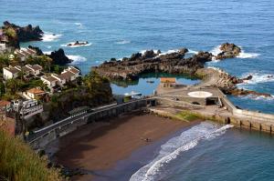 an aerial view of a beach next to the ocean at Moradia Ponte de Pedra in São Vicente