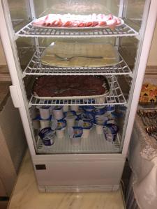 a refrigerator filled with lots of food and drinks at Hotel Flavia in Rome