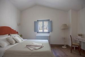 Postel nebo postele na pokoji v ubytování Podere La Contessa B&B