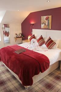 מיטה או מיטות בחדר ב-St John's Lodge incl off-site leisure club