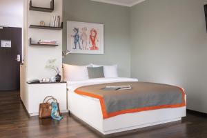 Llit o llits en una habitació de THE FLAG Zürich