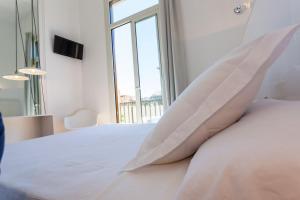 Posteľ alebo postele v izbe v ubytovaní Hostal Argo