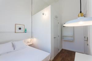 Posteľ alebo postele v izbe v ubytovaní Hostal Argo