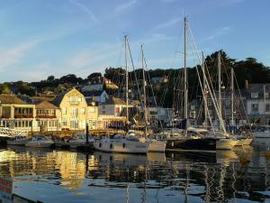 a group of boats are docked in a harbor at Althea House with parking in Padstow