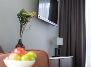 TV a/nebo společenská místnost v ubytování anders Kontorhaus Hotel
