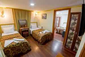Postel nebo postele na pokoji v ubytování Meddusa Hotel
