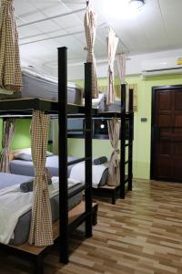 Ein Bett oder Betten in einem Zimmer der Unterkunft Tangmo House