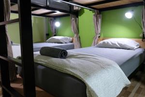 Ein Bett oder Betten in einem Zimmer der Unterkunft Tangmo House