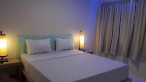 Ένα ή περισσότερα κρεβάτια σε δωμάτιο στο Bujang Lapuk Hostel