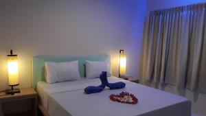 Ένα ή περισσότερα κρεβάτια σε δωμάτιο στο Bujang Lapuk Hostel