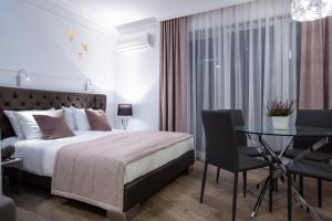 Posteľ alebo postele v izbe v ubytovaní Glamour Centrum