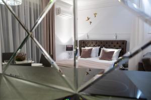 Posteľ alebo postele v izbe v ubytovaní Glamour Centrum