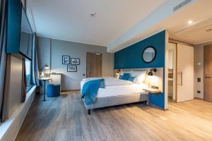 Postel nebo postele na pokoji v ubytování HARBR. hotel Konstanz
