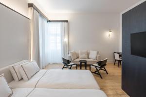 Postel nebo postele na pokoji v ubytování S Paul City Hotel