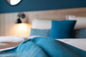 Postel nebo postele na pokoji v ubytování HARBR. hotel Konstanz