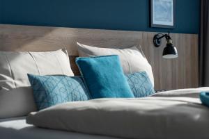 Postel nebo postele na pokoji v ubytování HARBR. hotel Konstanz