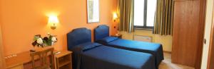 Letto o letti in una camera di Hotel Bed and Breakfast Il Granaio Mantova
