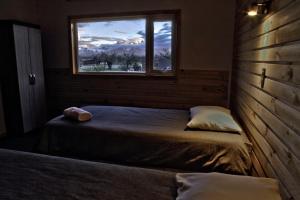 Un pat sau paturi într-o cameră la PAMPA HOSTEL